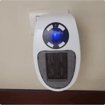Ultra Air Heater plugged into a bedroom wall outlet with the blue display lit